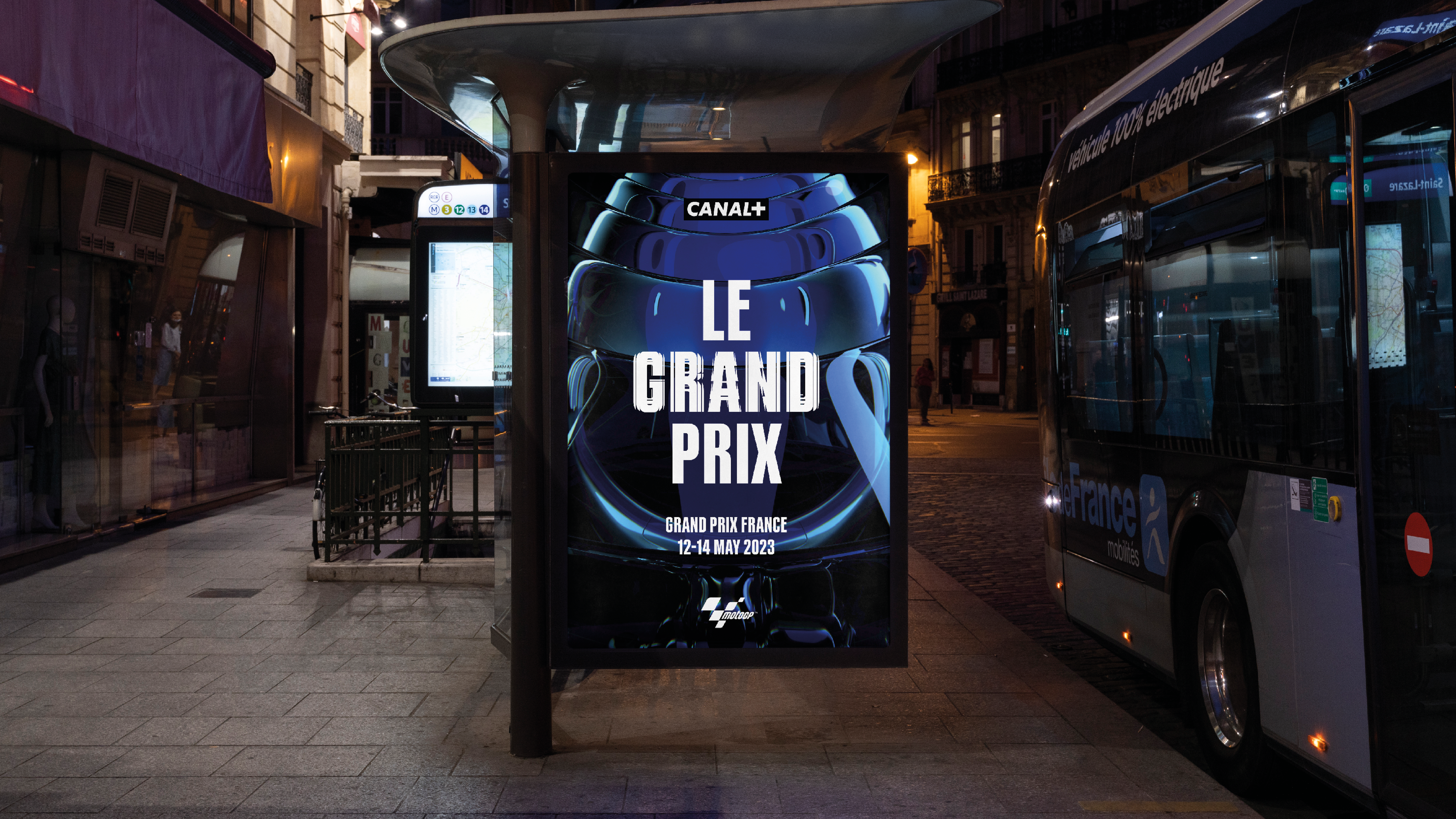 An out of home digital screen at a bus stop showing a Canal+ ad for Le Grand Prix