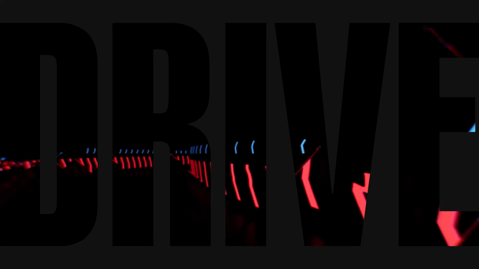 Digital blue and red lights in a repeating arrow pattern on a black background inside the word DRIVE